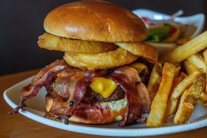 A look at the Malik Reneau Burger on Thursday, June 15, 2023, at Big Woods Speedway. The burger is a partnership between Indiana University basketball player Malik Reneau and the restaurant. A $1 donation is given to Big Brothers Big Sisters of South Central Indiana for every burger purchased.